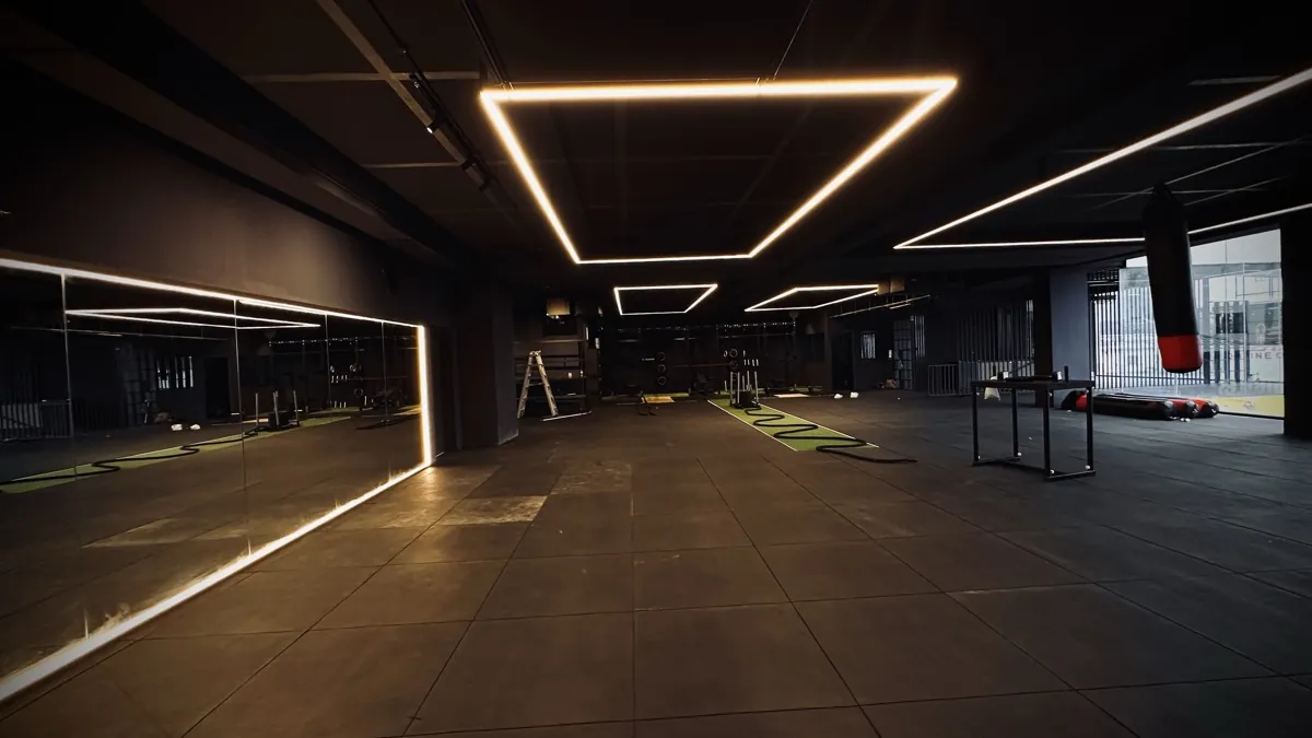 Wide view of the Kongquer training floor with LED lighting and mirrors